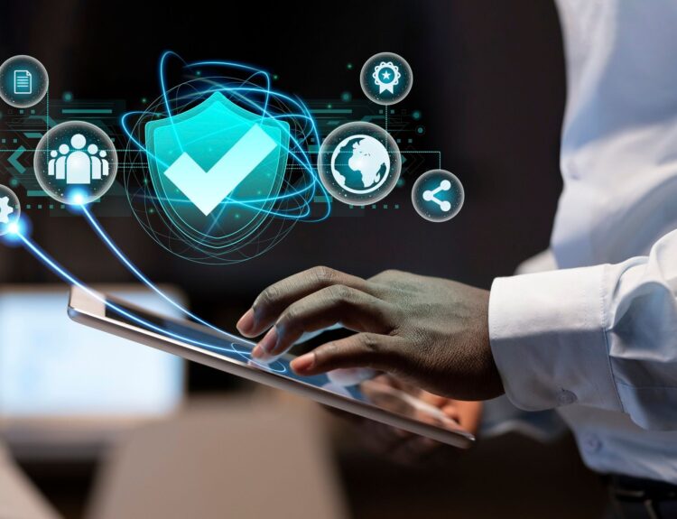 Person using tablet with security icons